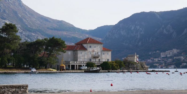 Beautiful coastal landscape of Montenegro with historic architecture and mountains.